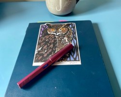 Notebook, pen and coffee mug